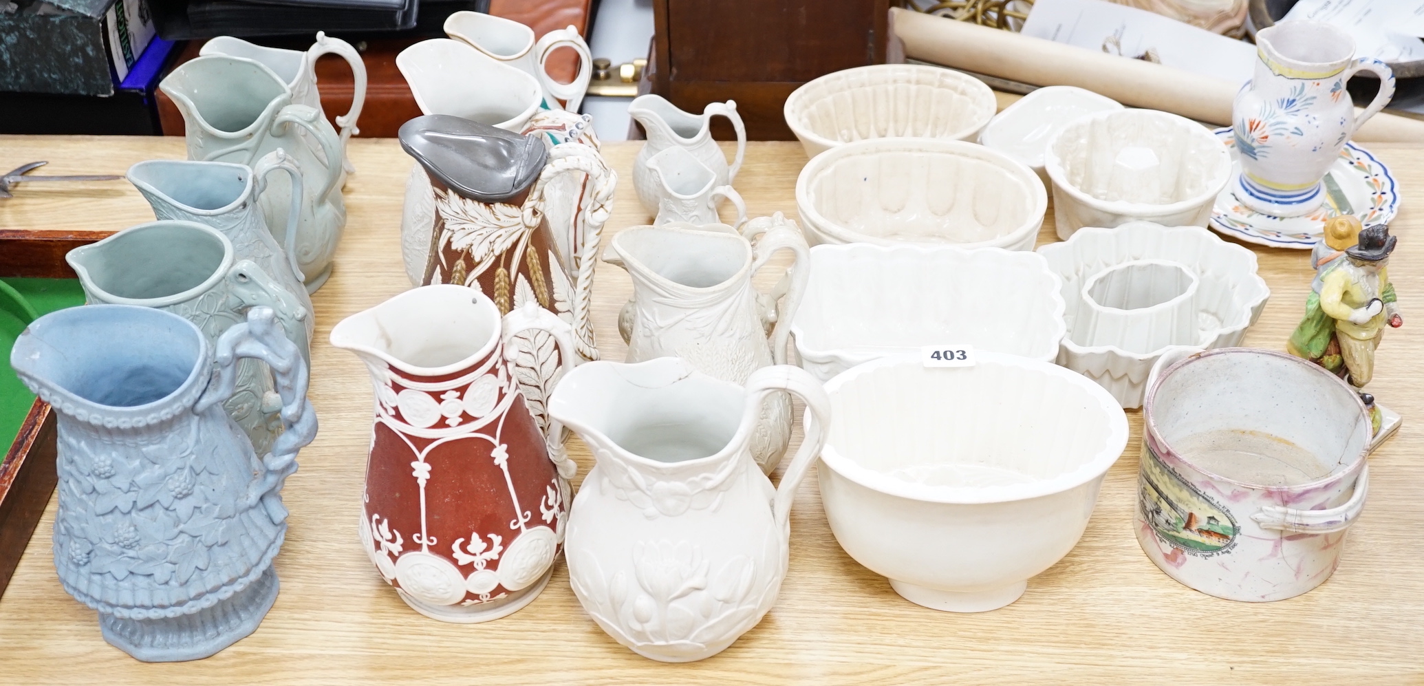 Large collection of mostly 19th century ceramics including Staffordshire figures, jugs, jelly moulds and a twin handled cup, the largest 24cm high